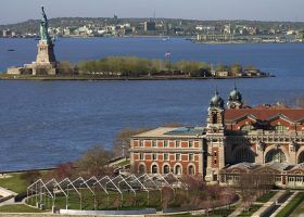 Top Things to See at Ellis Island and the Statue of Liberty in 2025 Ellis Island and the statue of liberty in the background.